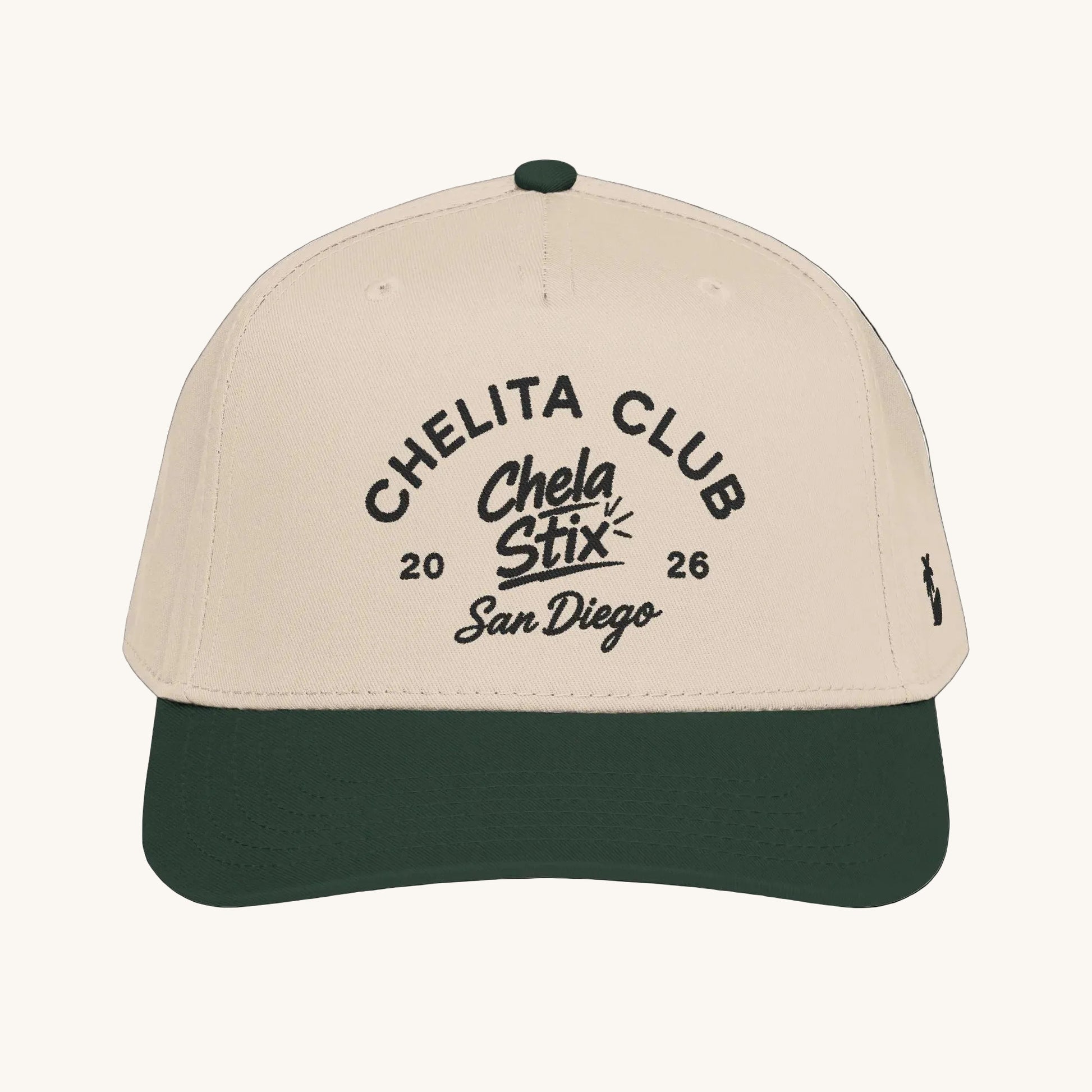 A structured baseball cap with a light beige crown and a dark forest green visor, featuring black embroidered text on the front that reads 'CHELITA CLUB Chela Stix 2026 San Diego' and a small black logo on the side.