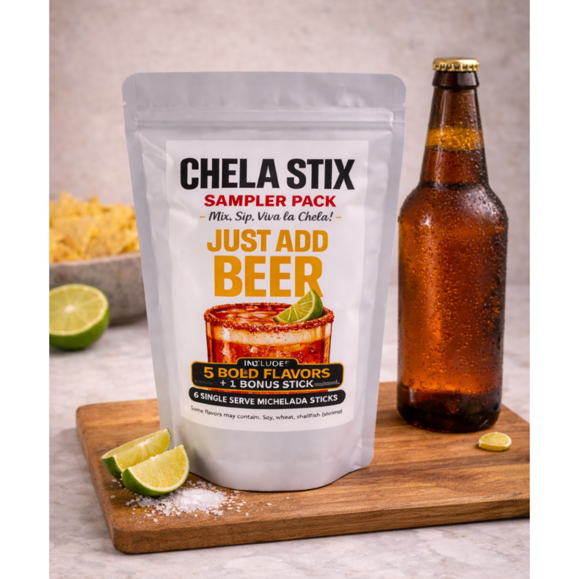 Chela Stix sampler pack with a bottle of beer on a wooden board.