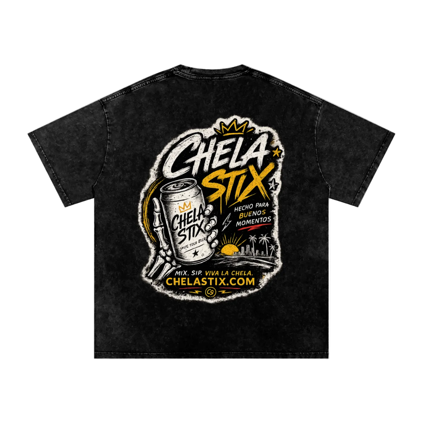 A black acid-wash t-shirt featuring a large back graphic for 'Chela Stix'. The graphic includes a hand holding a can of Chela Stix, a crown, and the text 'Chela Stix' in stylized white and yellow lettering, along with 'Hecho para enfrentar momentos' and 'ChelaStix.