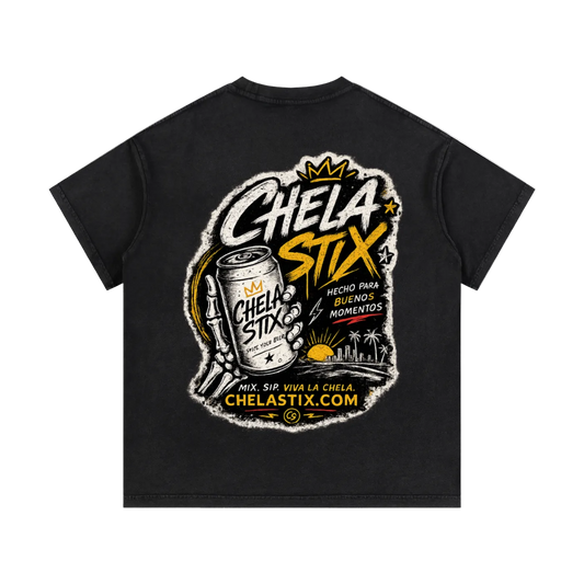 A black short-sleeve t-shirt shown from the back, featuring a large graphic print for 'Chela Stix'. The graphic includes a can of Chela Stix, a pencil, and text such as 'Chela Stix', 'Hecho para buenos momentos', and 'ChelaStix.